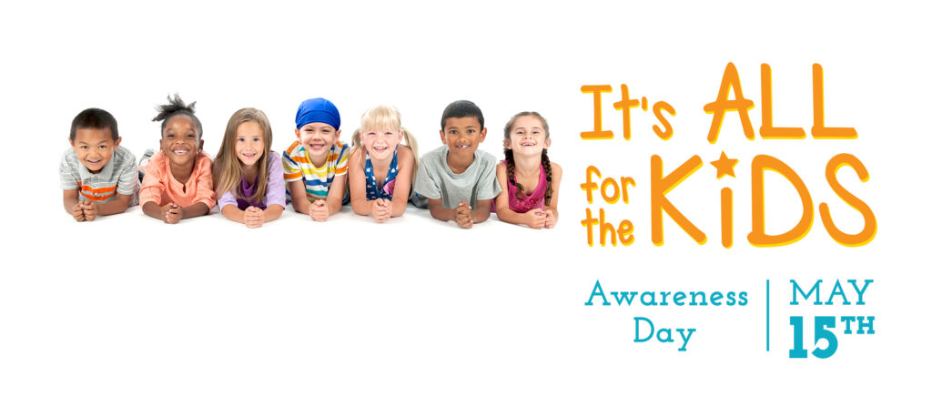 Seven smiling kids posing for the Its all for the kids awareness day logo
