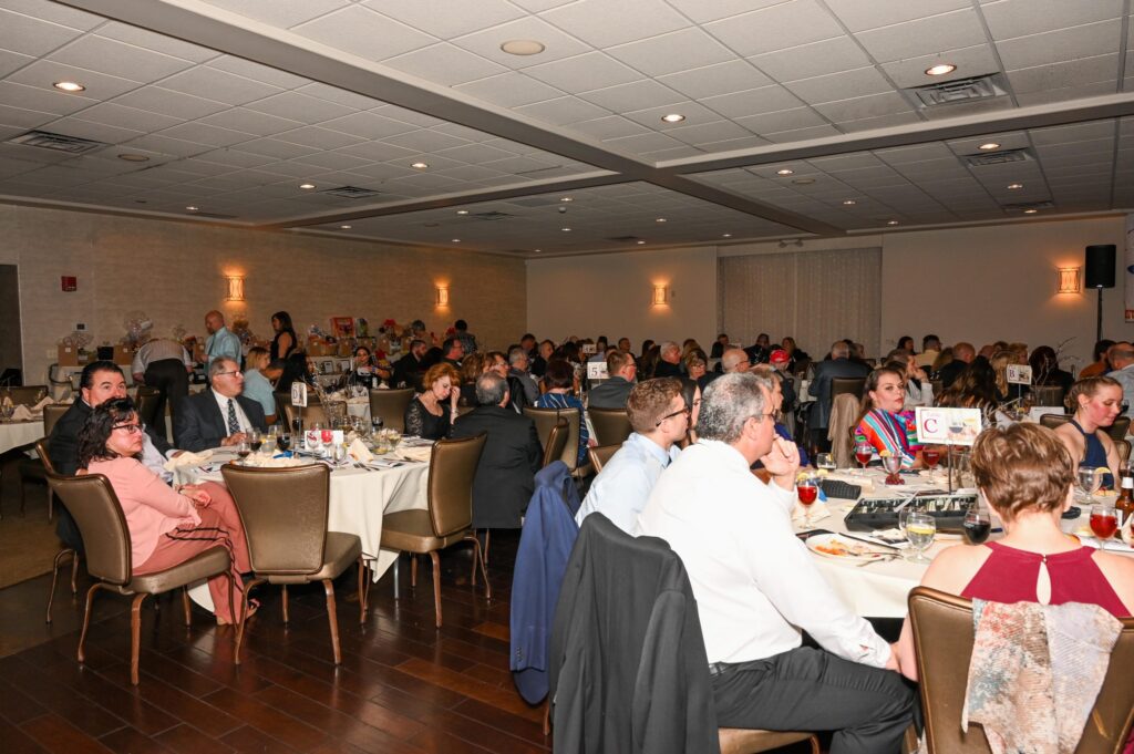 A Banquet Hall Full Of People Attending A Hope Foundation Fundraiser