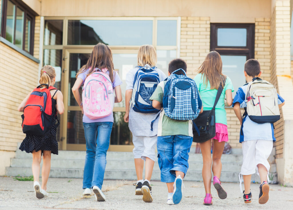 Six Children Walking Into School